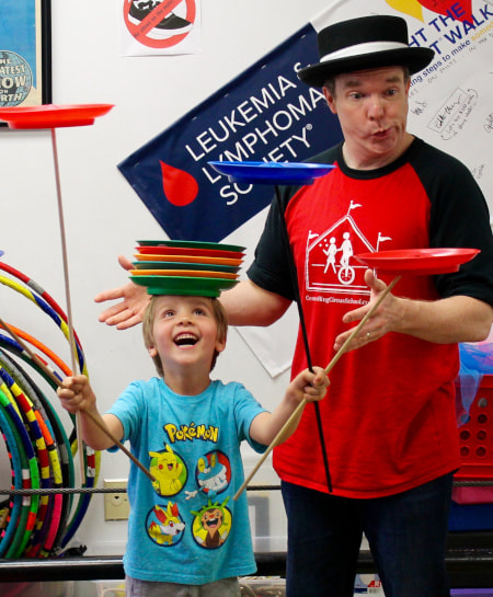 Spinning Pplates with Audience Volunteer at Family Fun Circus Show