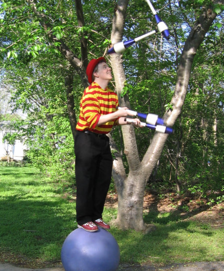 Rolling Globe and Juggling with Greg May variety performance artist