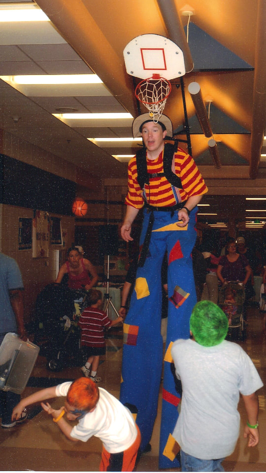 Greg May Stilt Basketball at School Carnival